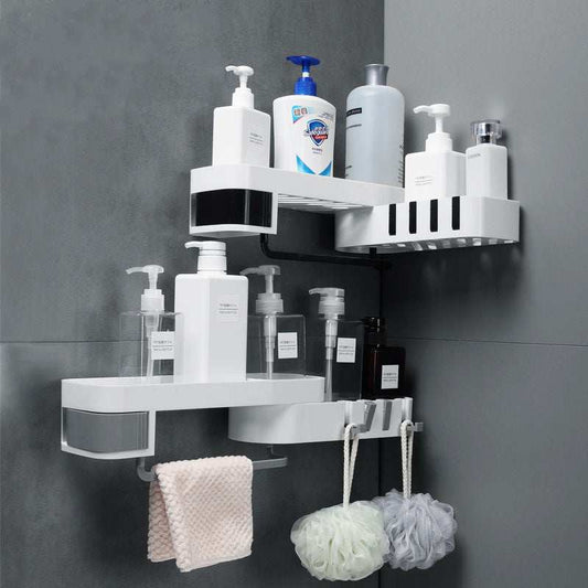 Black and white and grey and white plastic bathroom corner shelves mounted in a bathroom corner