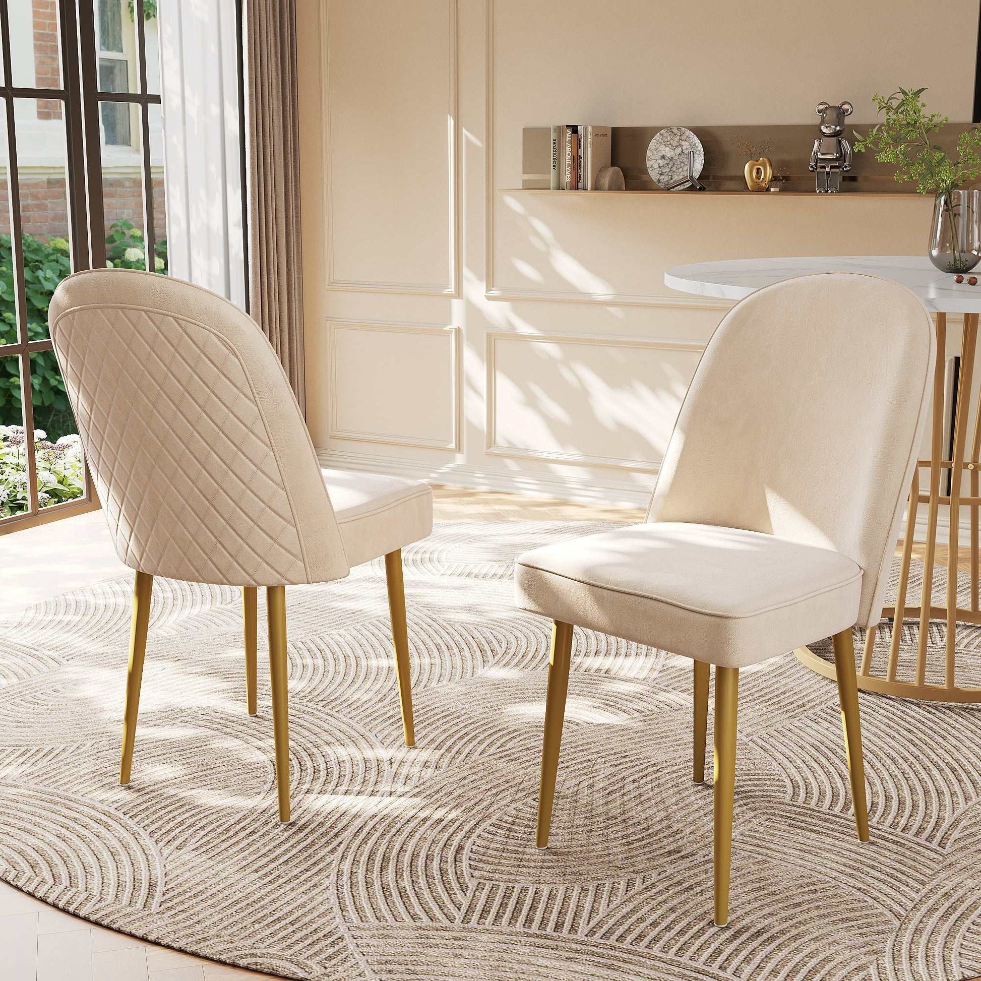 Set of six beige velvet dining chairs with gold metal legs in modern dining room setting
